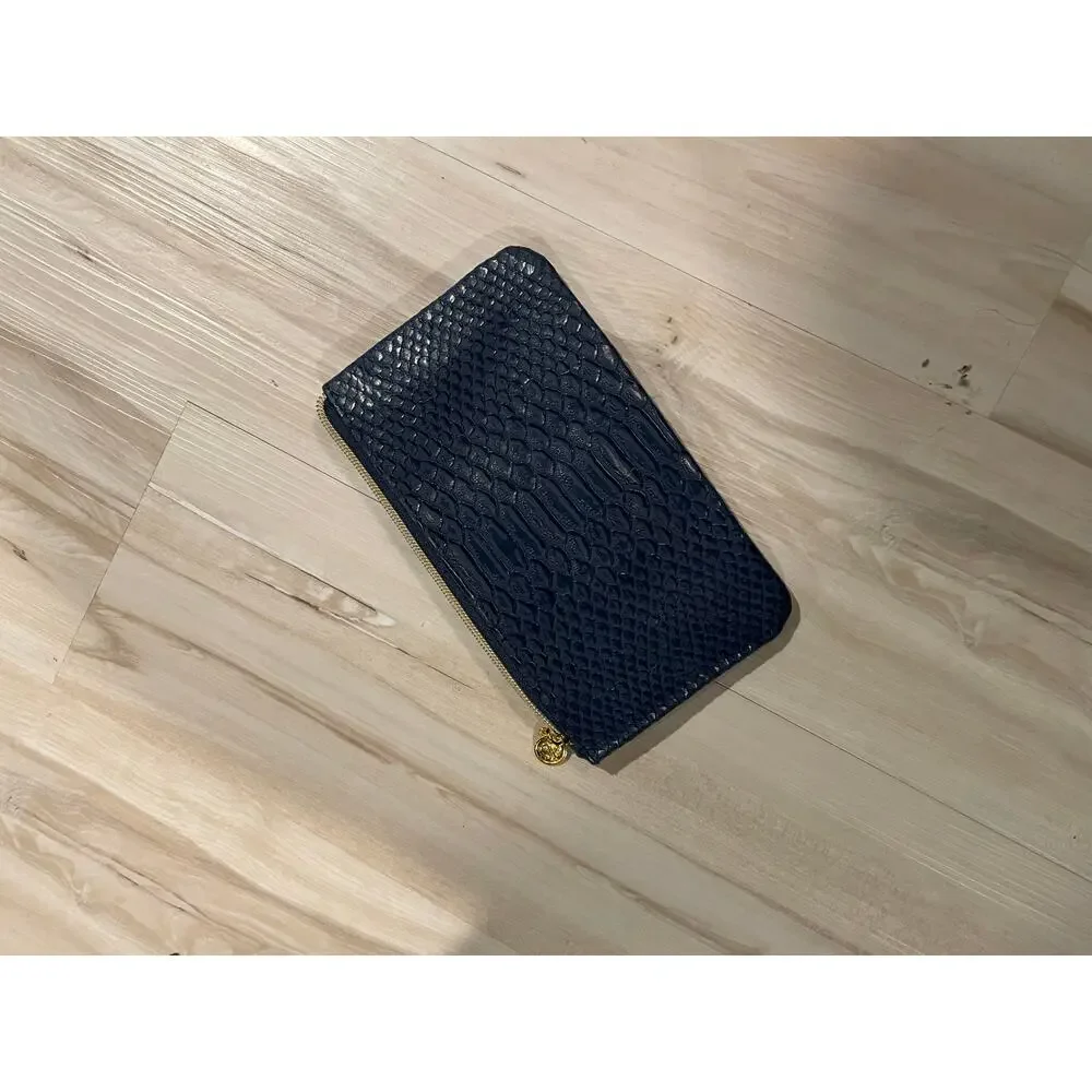 Cle de peau beaute navy snakeskin makeup bag